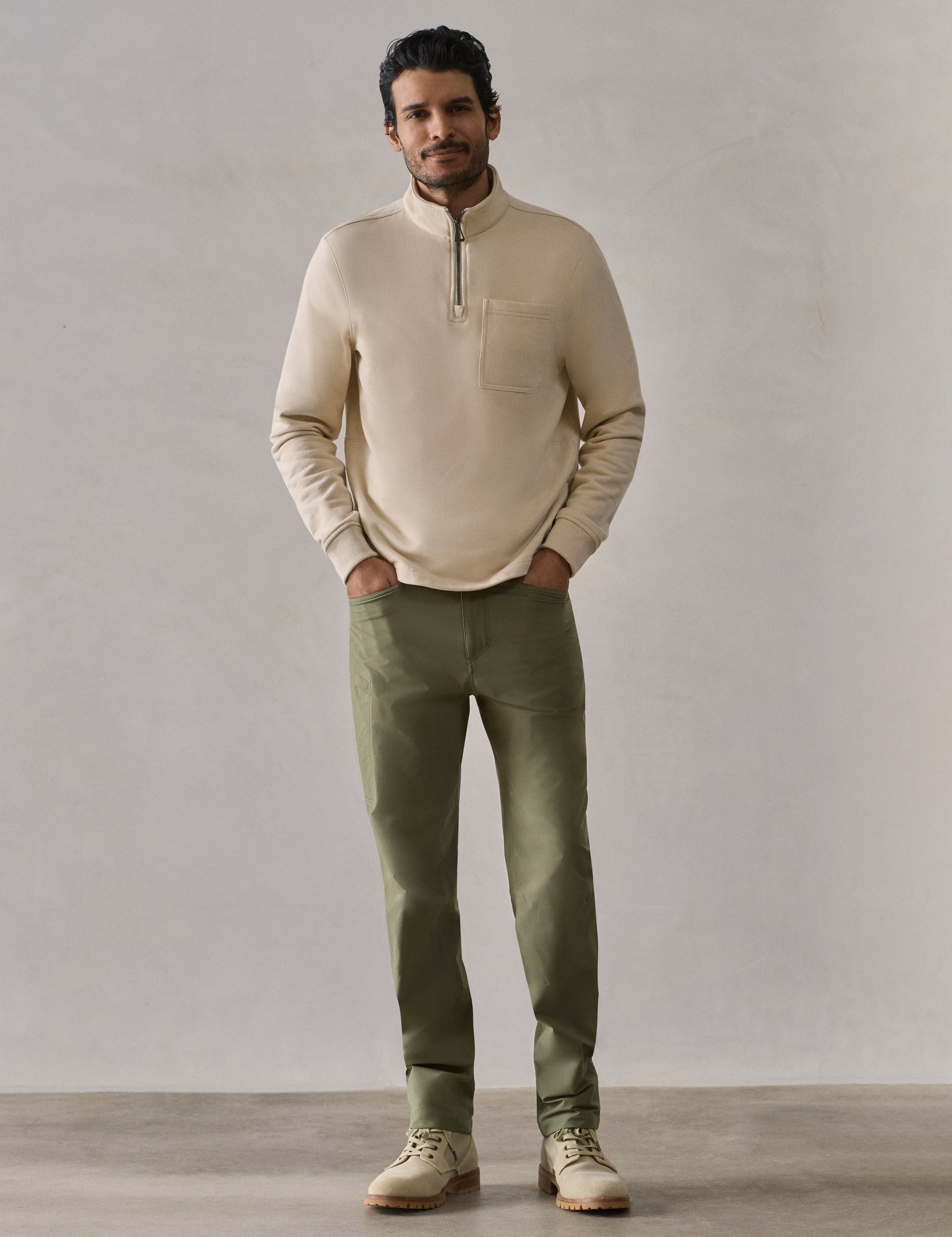 Front full-body view of man wearing Monte Half-Zip Sweatshirt in Bone white from AETHER Apparel.