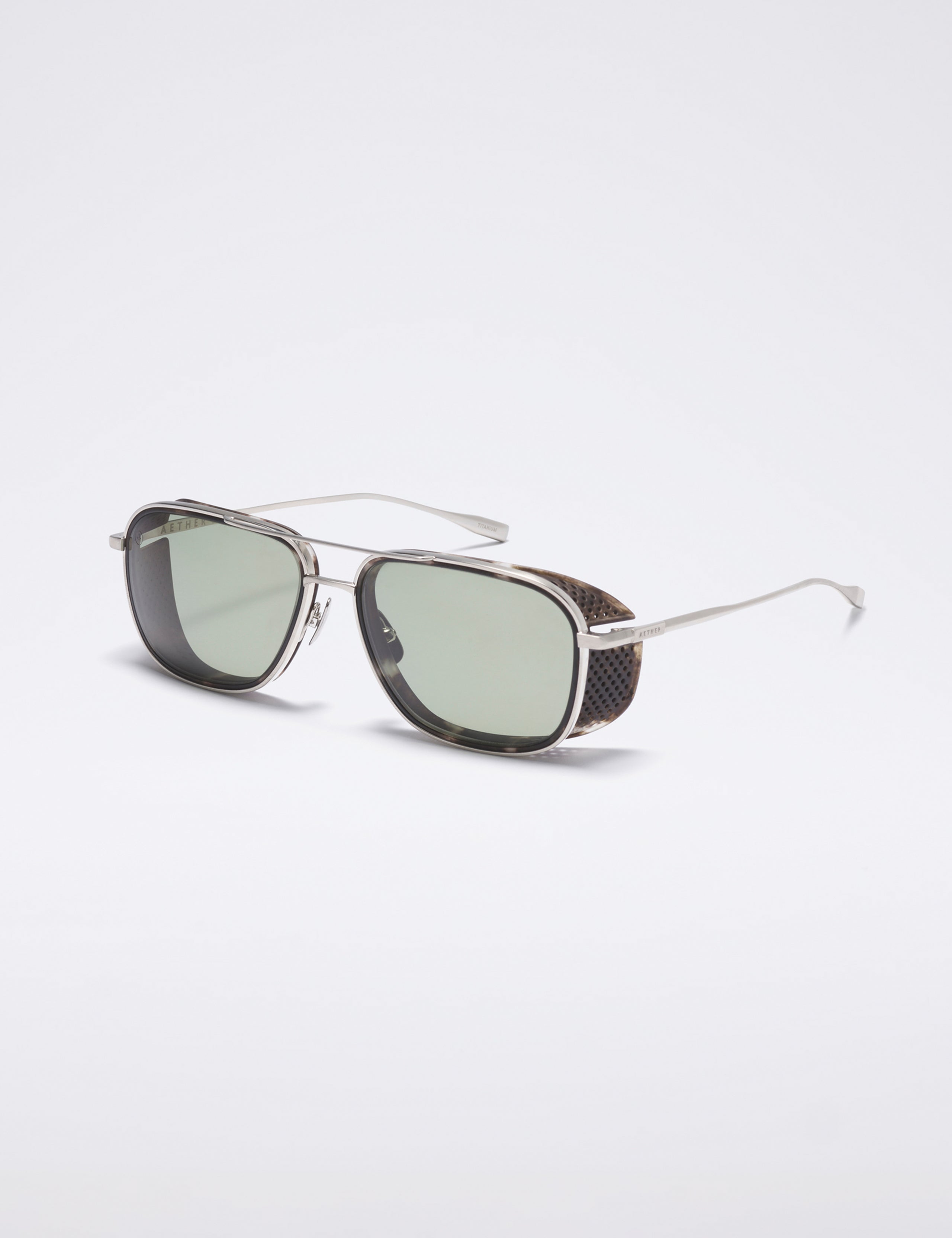 Front 3/4 view of Summit Sunglass in Brushed Silver titanium with Grey Lens from AETHER Apparel.